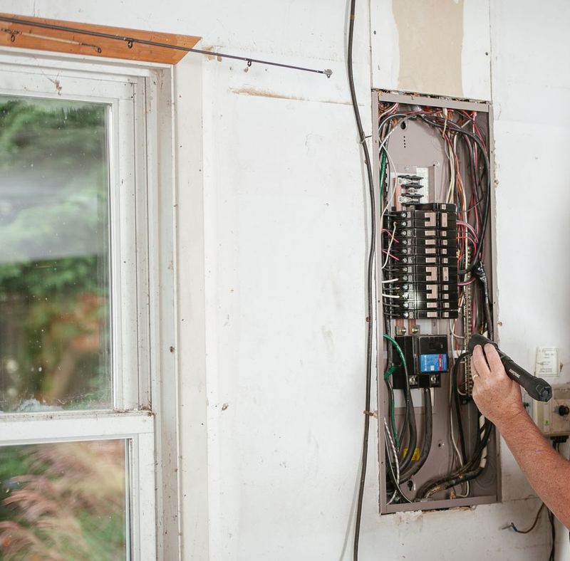 Open residential breaker panel in a garage